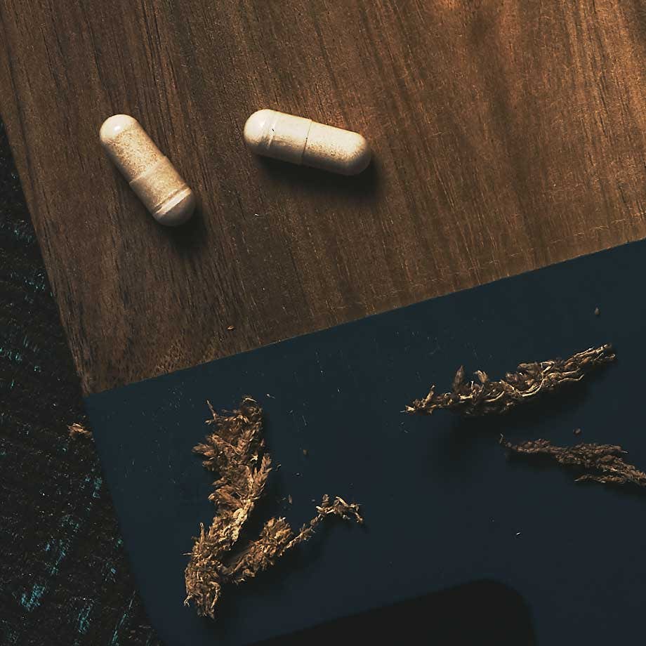 Alpha BRAIN® capsules on cutting board