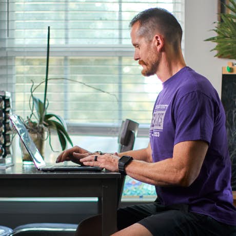 Man watching certifications courses online.