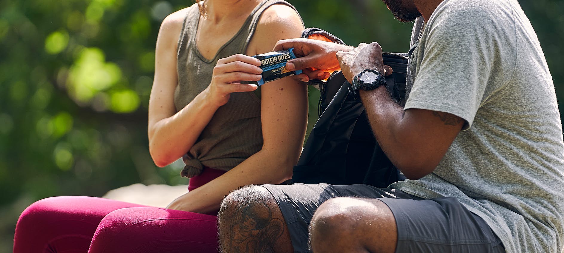 woman giving a man a protein bite